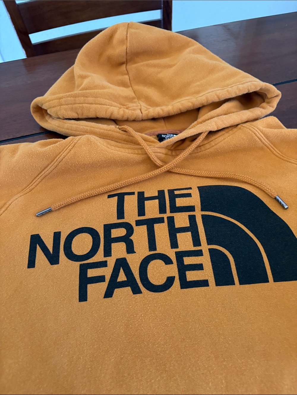 The North Face Men’s deep yellow/orange Logo Pullover Hoodie